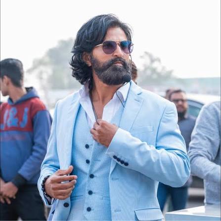 Dev Gadhvi in a light blue suit